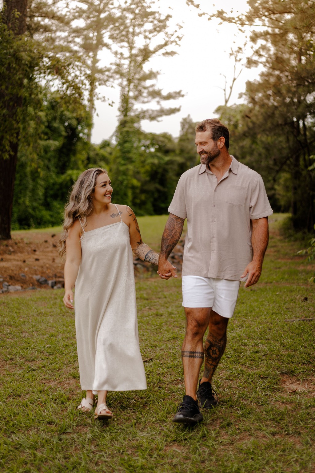 Shane and Alycea smiling while walking together