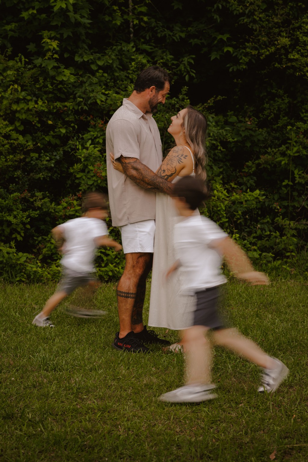 Children running around their parents