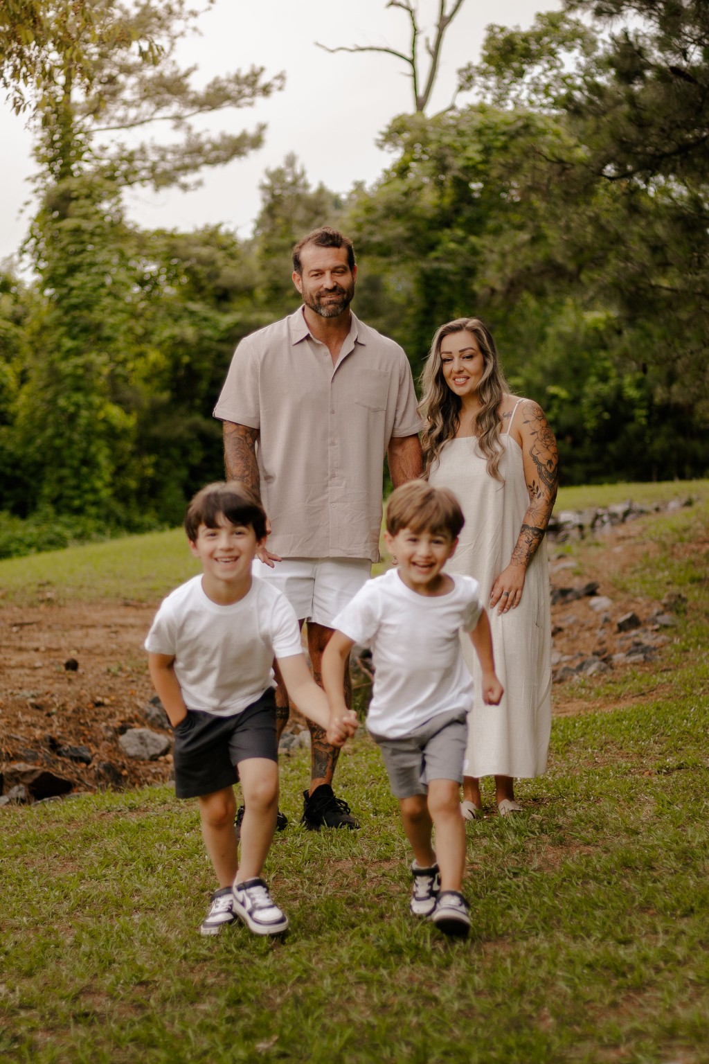 The family walking outdoors together