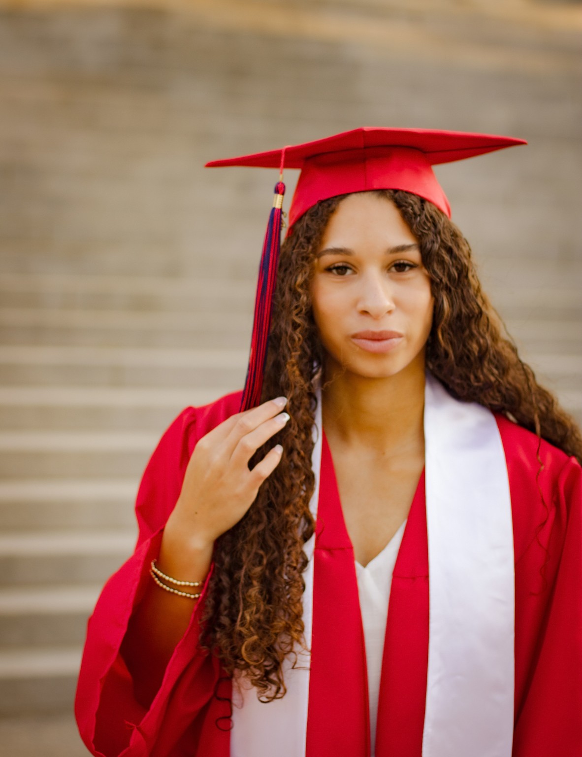 Close portrait of Layla in her graduation cap and gown