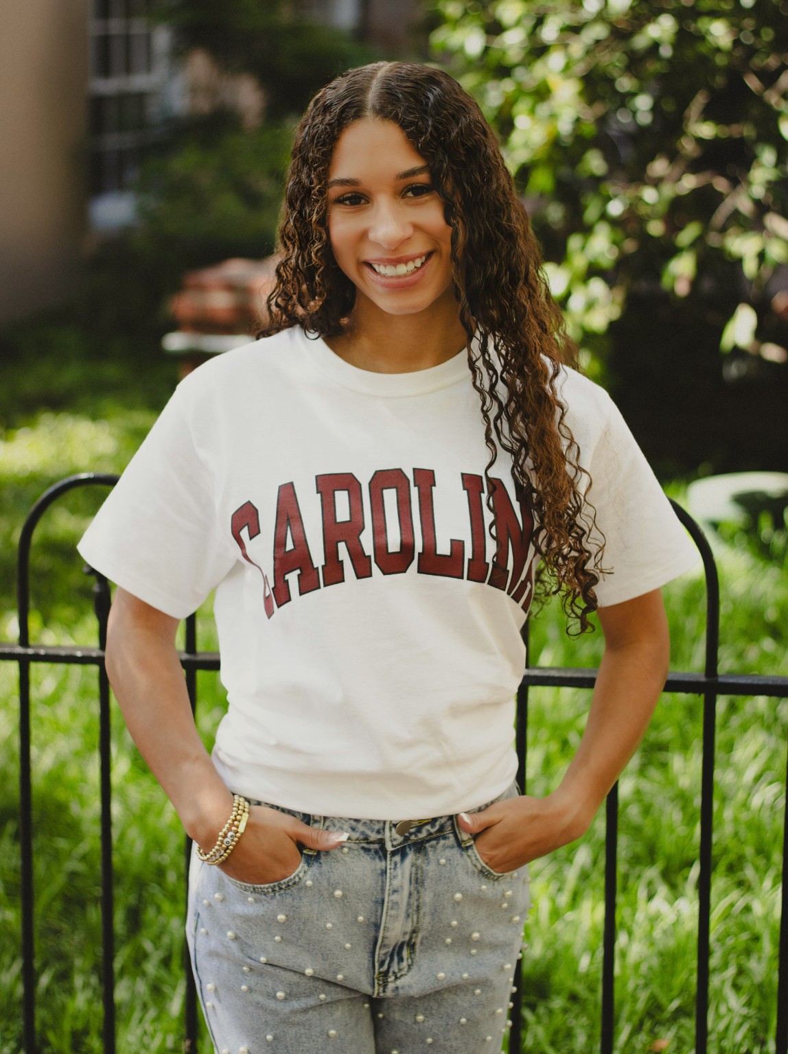 Layla wearing a Carolina shirt during her senior session