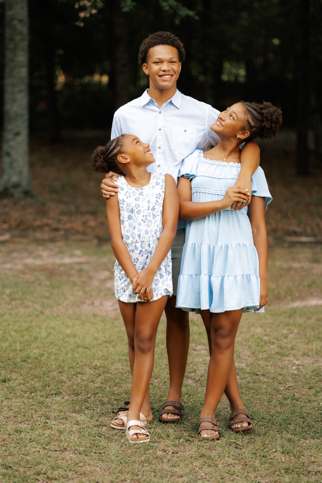 A father laughing with his daughters