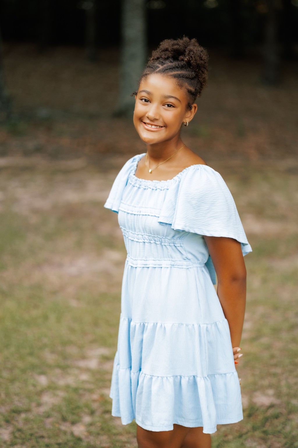 Portrait of a daughter in a light blue dress
