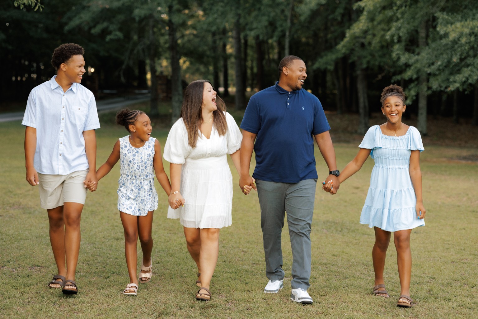 The Springs Family walking together outdoors