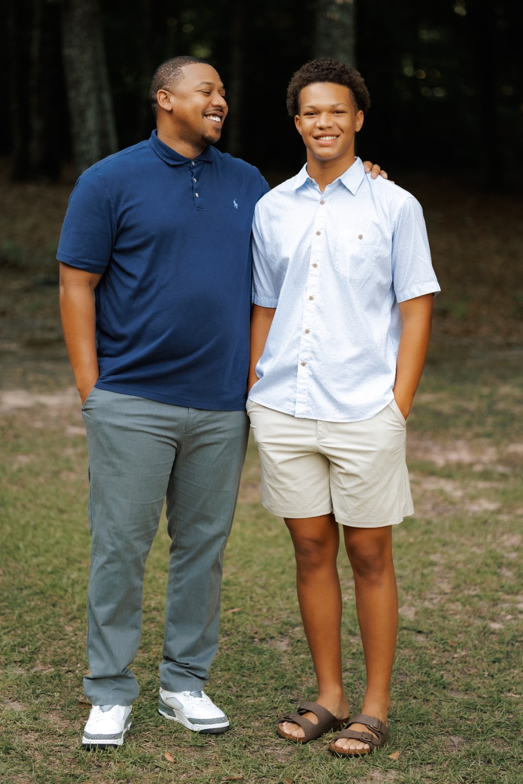 A father and son standing together