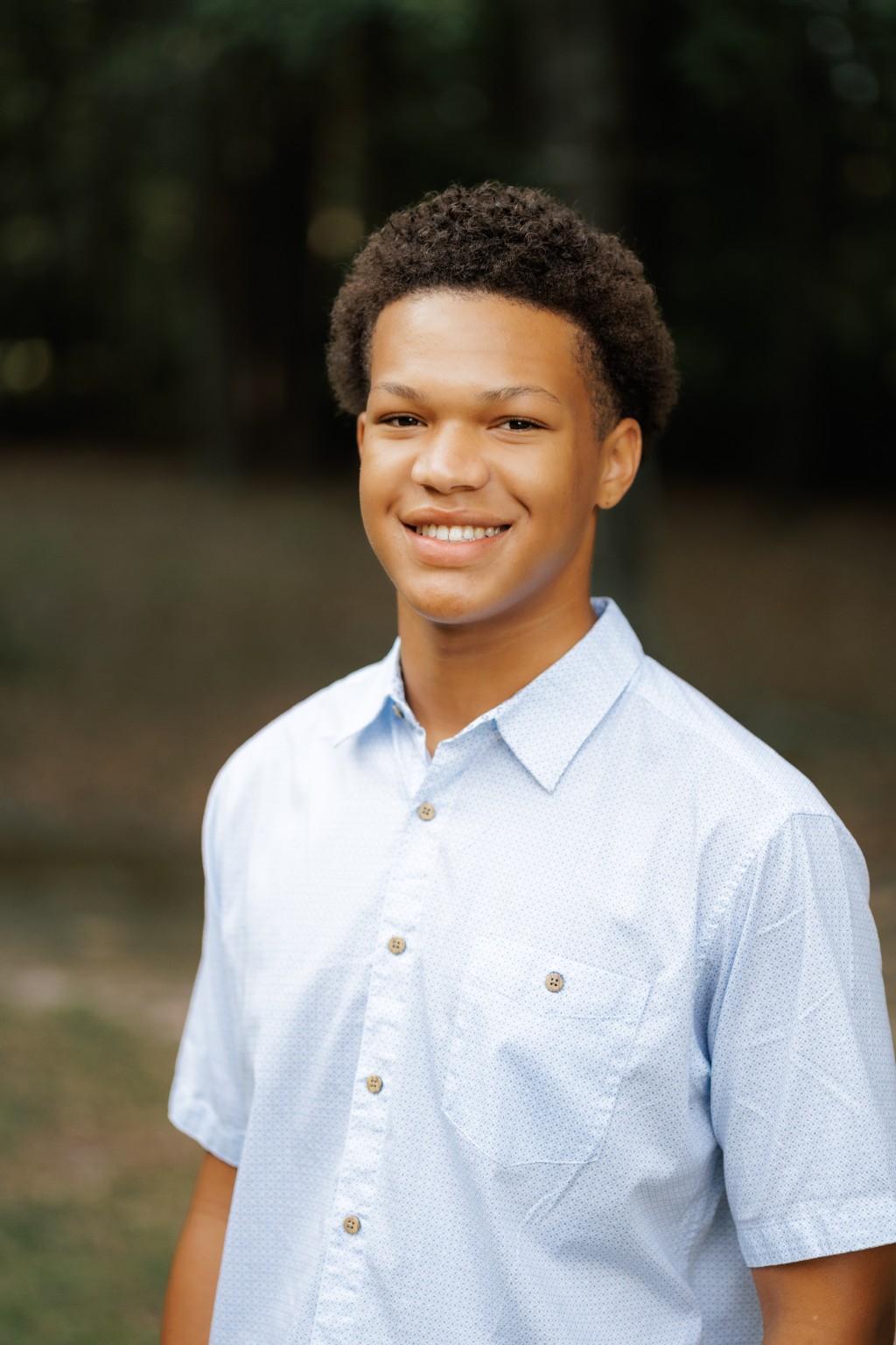 Portrait of a son in a light blue shirt